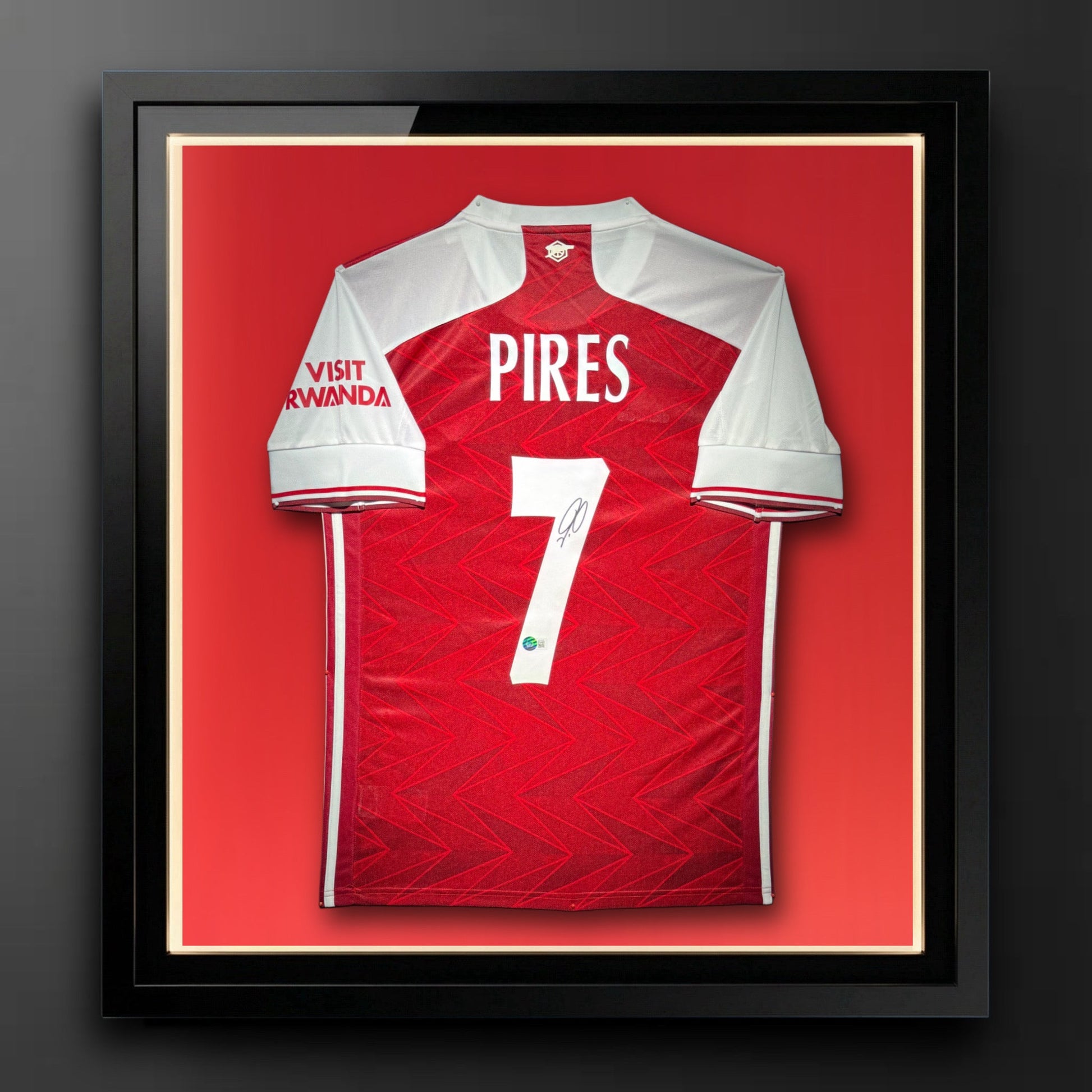 Robert Pires Signed Arsenal Jersey.Certified by Beckett authentic-signatures